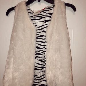 White furry vest